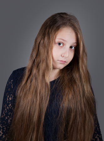 Portrait of a 10 year old girl, studio shot.の写真素材