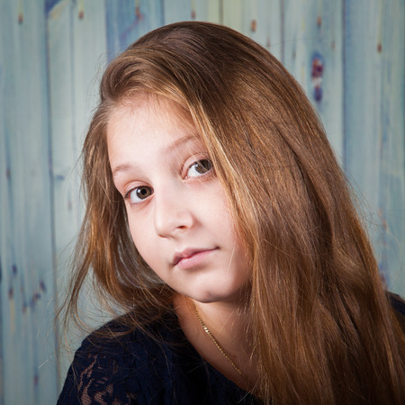 Portrait of a 10 year old girl, studio shot.の写真素材