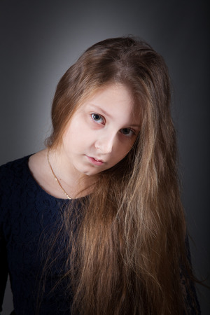 Portrait of a 10 year old girl, studio shot.の写真素材