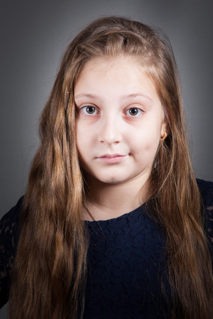Portrait of a 10 year old girl, studio shot.の写真素材