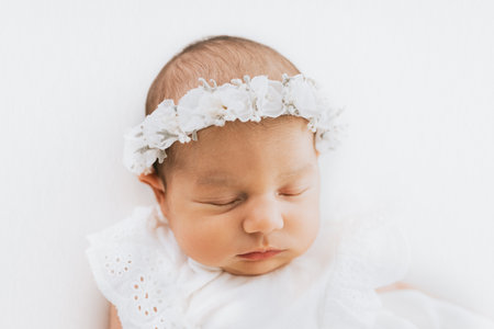 Newborn baby girl portraits, photographed in studio, on white.の写真素材