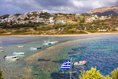 Scenic view of sea bay with boats and beach in background, in winter, in Anavyssos, Greece. Image taken from Agios Nikolaos Peninsula.の写真素材