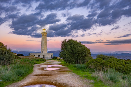 Sunset over Gytheio (Cranae) Lighthouse, during winter, in Laconia, Greece.の写真素材