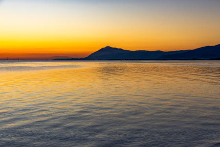 Golden Sunset in winter over the Golf Of Corinth, Greece.の写真素材