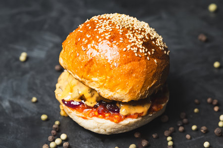 Juicy homemade burger on gray background.の写真素材