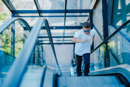Urban portrait of a 10 year old boy in a city scenery.の写真素材