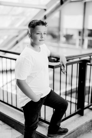 Urban portrait of a 10 year old boy in a city scenery.の写真素材