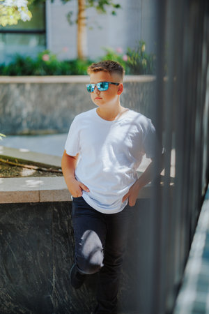 Urban portrait of a 10 year old boy in a city scenery.の写真素材