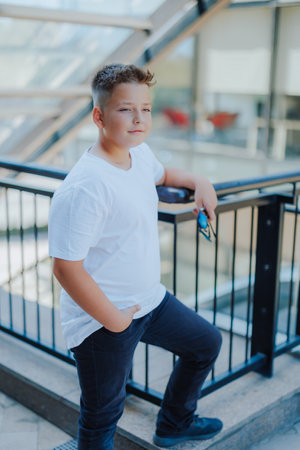 Urban portrait of a 10 year old boy in a city scenery.の写真素材