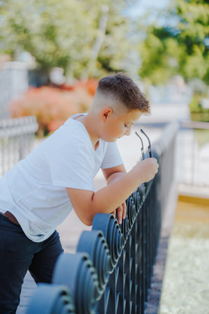 Urban portrait of a 10 year old boy in a city scenery.の写真素材