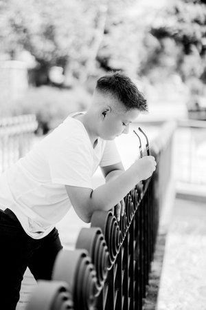Urban portrait of a 10 year old boy in a city scenery.の写真素材