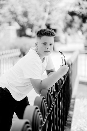 Urban portrait of a 10 year old boy in a city scenery.の写真素材
