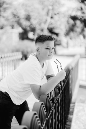 Urban portrait of a 10 year old boy in a city scenery.の写真素材