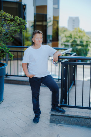 Urban portrait of a 10 year old boy in a city scenery.の写真素材
