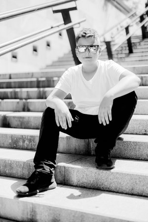 Urban portrait of a 10 year old boy in a city scenery.の写真素材