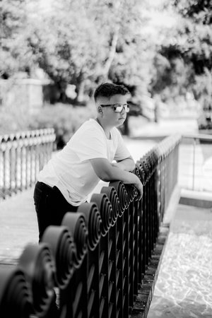 Urban portrait of a 10 year old boy in a city scenery.の写真素材