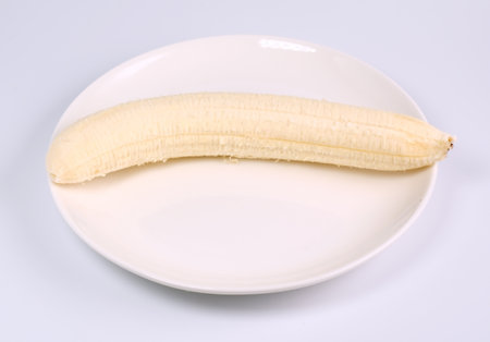 fruit banana in plate on white backgroundの写真素材