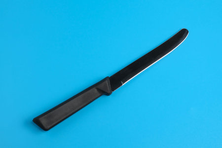 kitchen knife on blue background