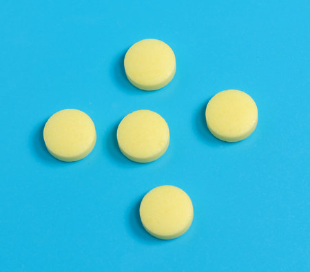 medical drug tablet pills on blue background