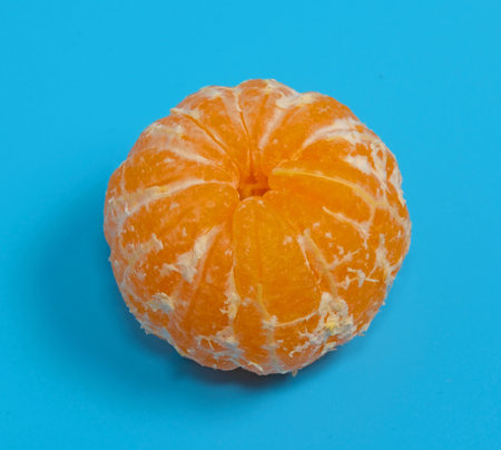 fresh orange fruit on blue backgroundの写真素材