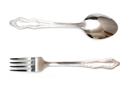 steel spoon and fork isolated on white background