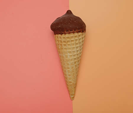 ice cream waffle cone on pink yellow backgroundの写真素材