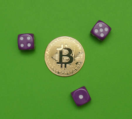 game dice with bitcoin coin crypto money on green backgroundの写真素材