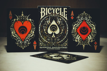 A deck of Bicycle Playing Cards Karnival Earthone9 with aces on a wooden background. Russia,...