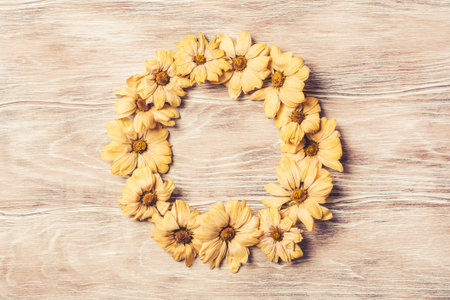 Autumn frame of dried flowers. Autumn composition of dried chamomile. fall concept. Autumn background. Flat lay, top view with copy space.の写真素材