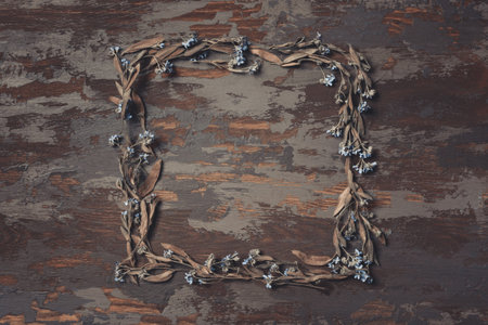 Dark autumn composition. Autumn frame of dried grass, leaves and flowers. Autumn background. Flat lay, top view, copy space.の写真素材