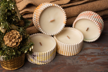 A set of different aroma candles. Scented handmade candle on a wooden background. Soy candles Aromatherapy and relax in spa and home.の写真素材