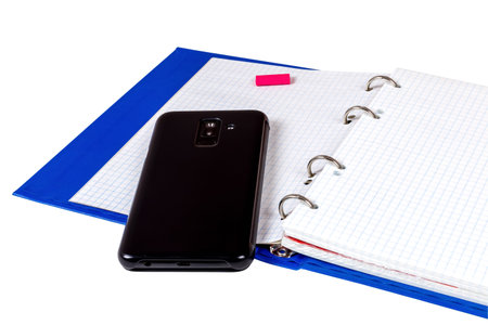Notebook open to entries from the phone lying on a page.