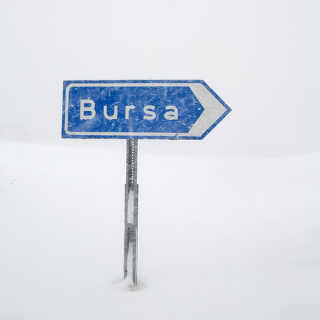 Road sign to Bursa under snow in Uludag, Turkeyの写真素材