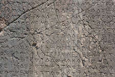 Macro view of script on Inscribed Pillar in Xanthos Ancient City, Antalya, Turkey