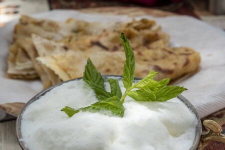 Traditional Turkish meal Gozleme with ayran on the table.の写真素材