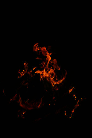 The Glares of the fire on black background.