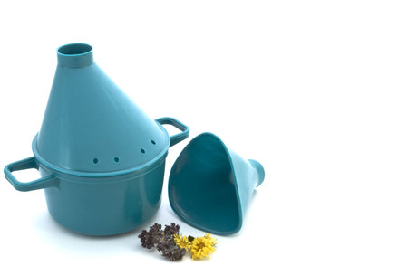 Inhaler and medicinal herbs on a white background. の写真素材