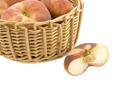 Ripe fig peaches in a wicker basket. の写真素材