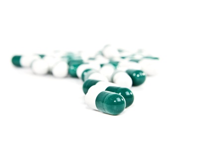 Many pills scattered on a white background .の写真素材