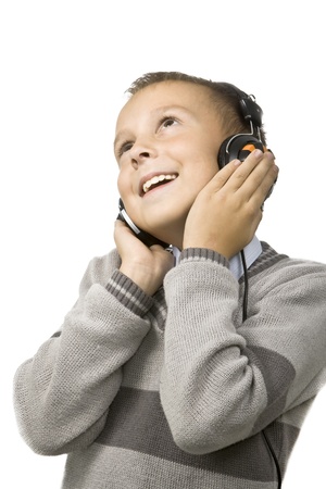 Boy listen to music and smiles, a white background.の写真素材