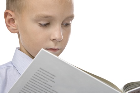 The boy school-age reads the book.の写真素材