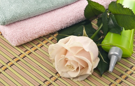 On a bamboo mat laid out items for spa procedures.の写真素材