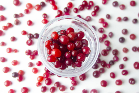 Top view. raw red cranberries in a glassの写真素材