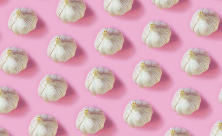 Ripe garlic pattern on a pink background, Vitamin concept