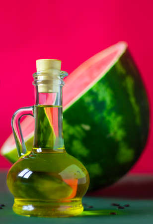 Watermelon seed oil in a glass jarの写真素材