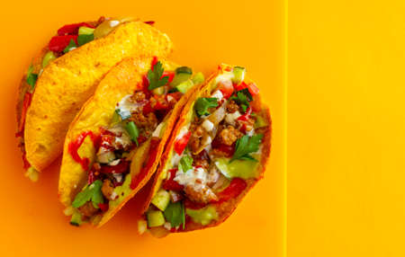 Mexican taco with Chicken on a yellow backgroundの写真素材