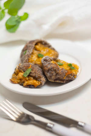 Stuffed Parasol Mushroom on white plateの写真素材