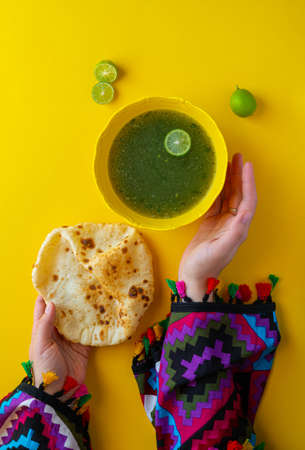 Woman hands and traditional Egyptian Molokhia soupの写真素材