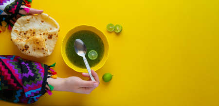 Woman eating traditional Egyptian Molokhia soupの写真素材