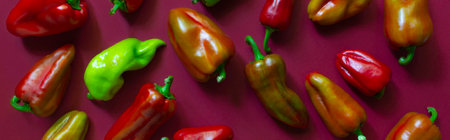 Pattern of bell peppers on the red background.の写真素材